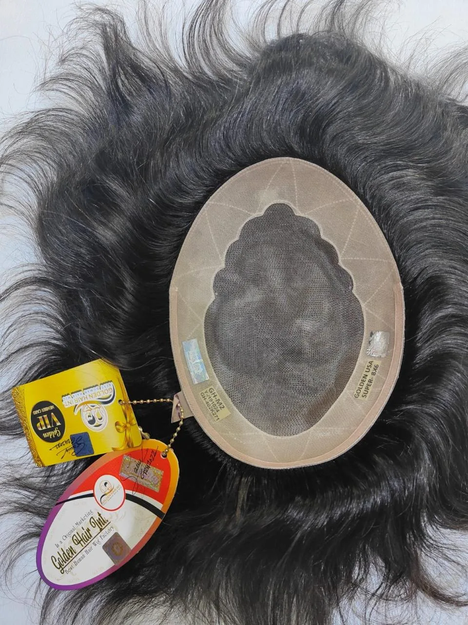 Underside of a hair patch showing its centre panel and perimeter