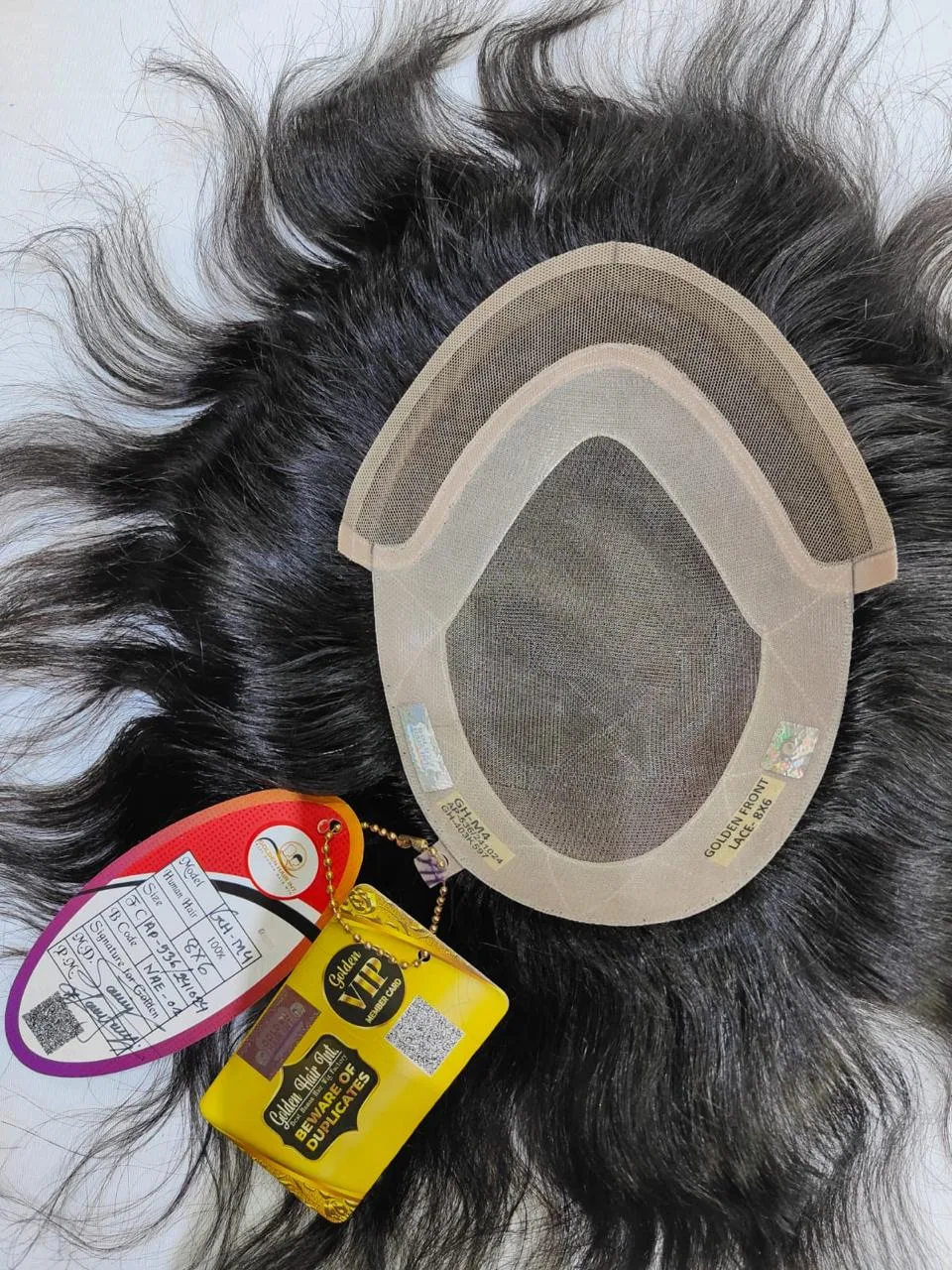 Hair patch with a visible mesh centre and surrounding attachment area
